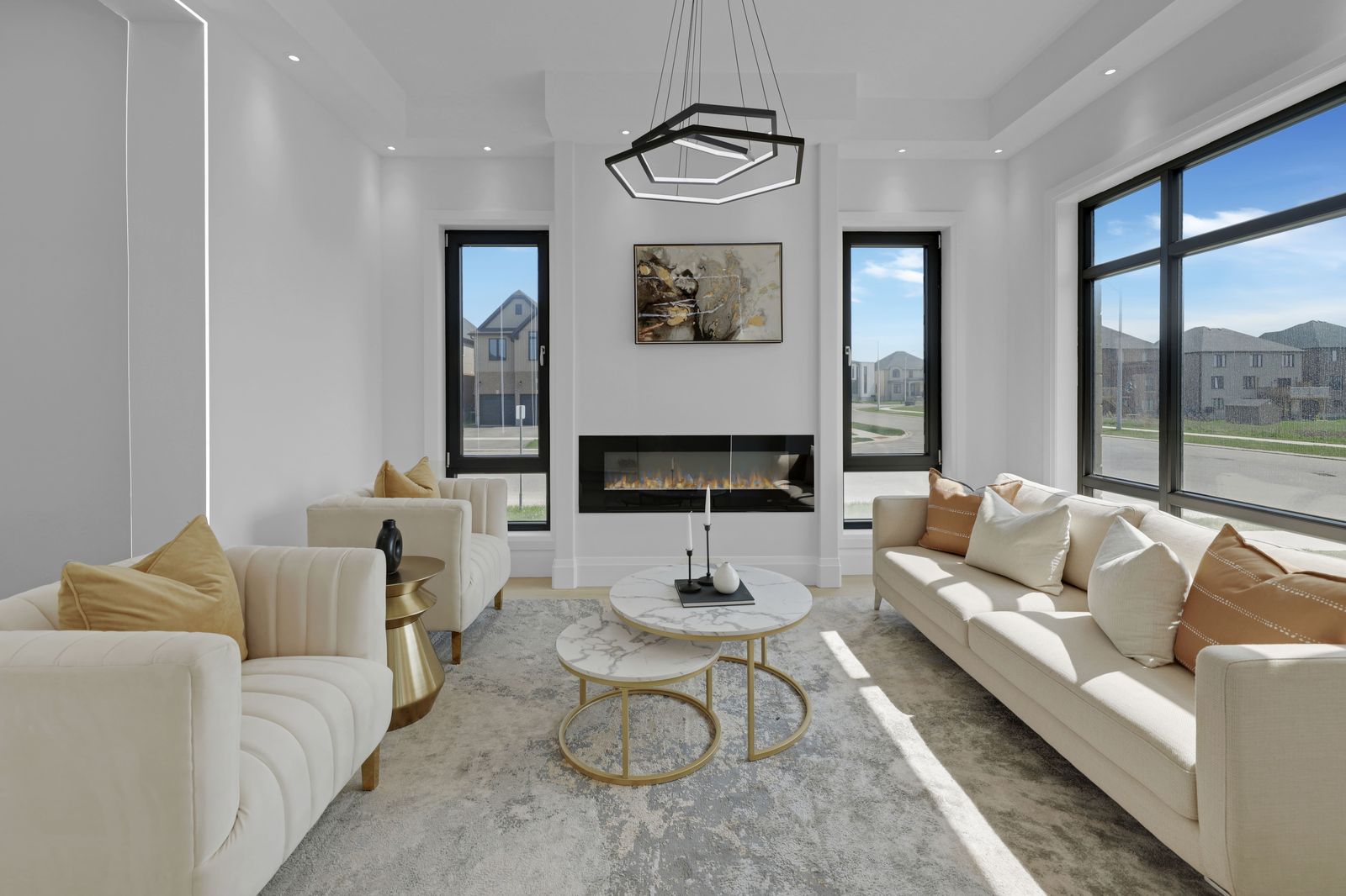 Great room with linear fireplace in a completed Carnaby home