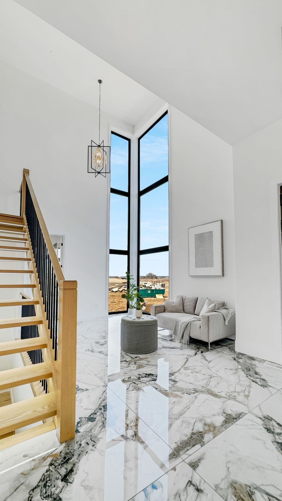 Two-storey foyer with feature staircase in a completed Carnaby home