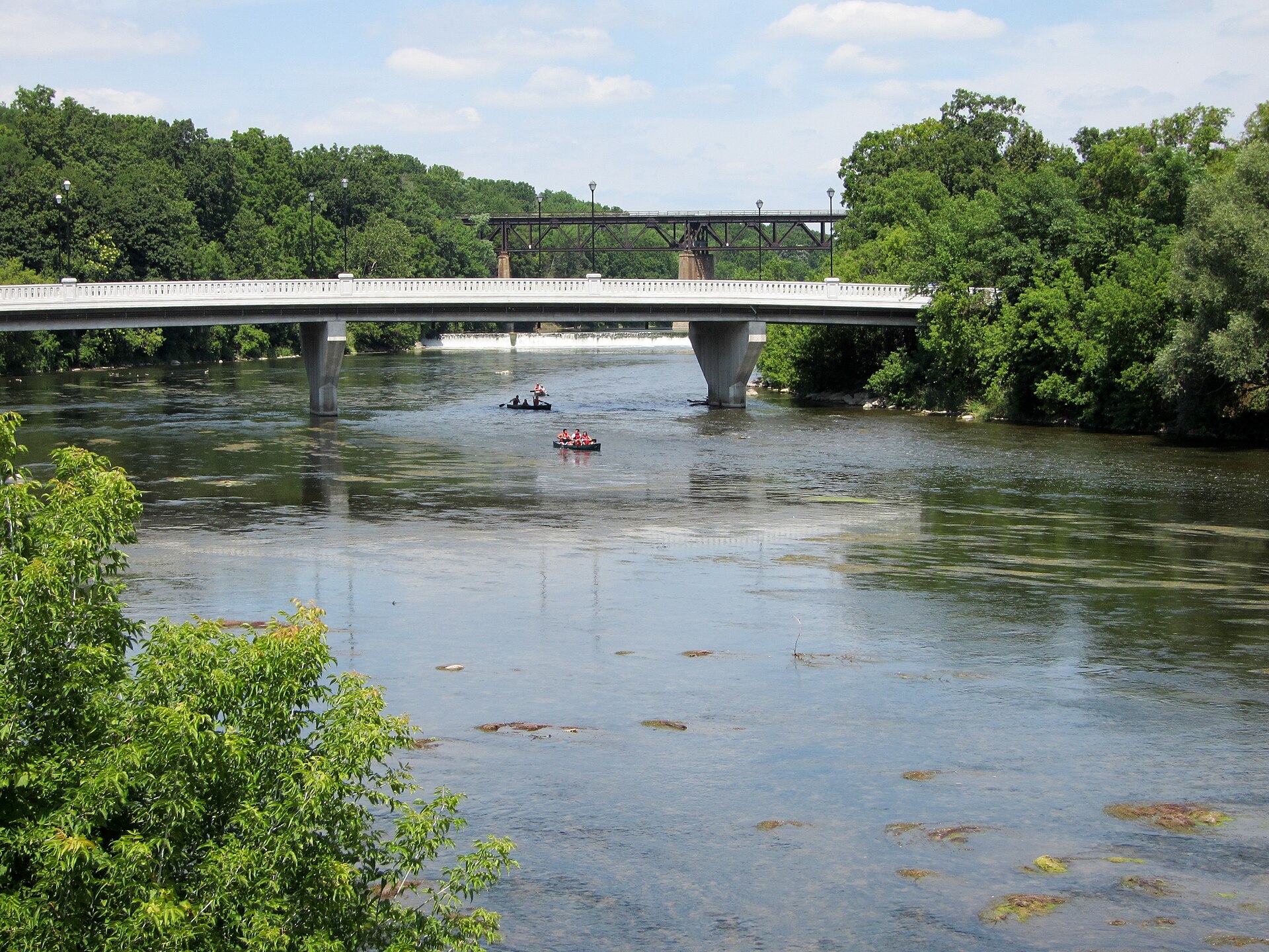 Bridges over the Grand River at Paris, Ontario, with rafters on the water below