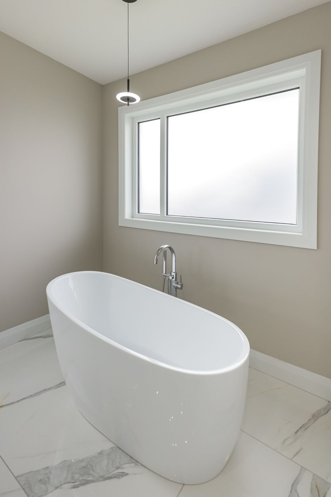 Freestanding soaker tub in a completed Carnaby home